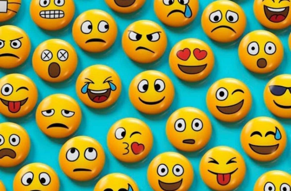 Sessão presencial "Emocion(arte)". Imagem com diversos emojis.